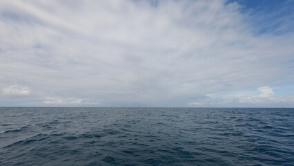Side view from boat in Indian ocean sailing between Seychelles islands in daytime