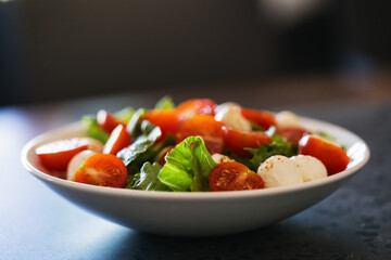 Salad with mozzarella balls tomatoes and mix salad