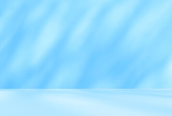 Empty blue room studio with shadow of leaves on concrete wall and floor for product presentation. Sunlight effect shadow. Minimal winter backdrop. Cosmetic, beauty and fashion showroom.