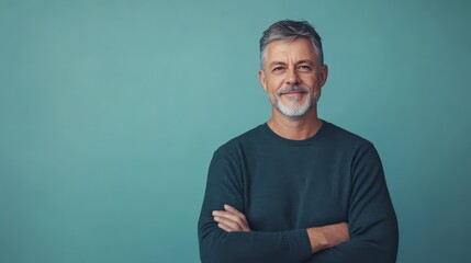 Fototapeta premium Confident Middle-Aged Man Smiling Against a Soft Blue Background