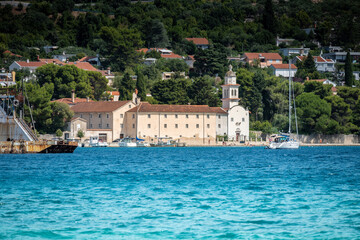 Beautiful St. Paul Monastery, rising next to the sea shore at the town of Cres, Croatia in northern Adriatic sea
