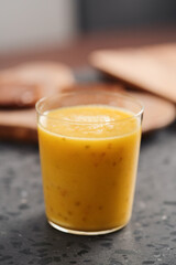 Fresh mango lulo smoothie on kitchen countertop