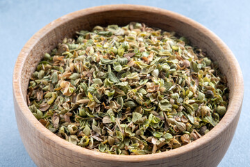 A bowl full of dried and ground natural mountain thyme,closeup