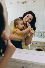 Dental care, mother brushing teeth with boy for wellness,Bathroom, oral health toothbrush