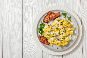 sacchettoni, pasta with bacon and cheese filling