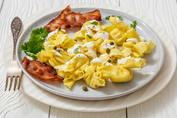 sacchettoni, pasta with bacon and cheese filling