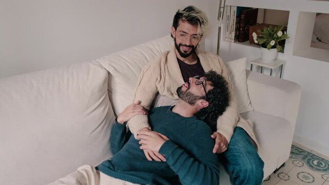 Gay Couple Relaxing Together At Home