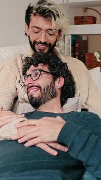 Vertical video, Gay Couple Relaxing Together At Home