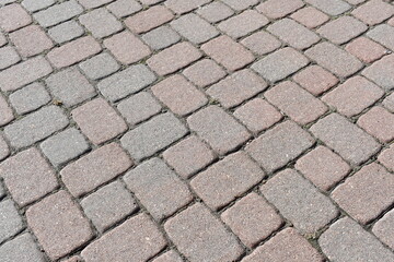 Cobblestone street, criss-cross pattern.