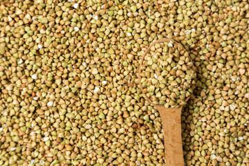 Green buckwheat isolated on white background, organic grain and healthy eating concept