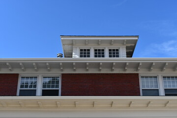 Craftsman style building with modern chimney.