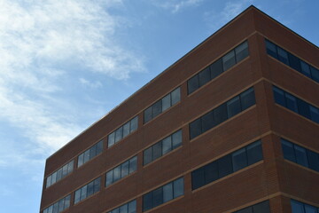 Brick hospital with lots of window.