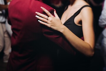 Couples dancing traditional latin argentinian dance milonga in a ballroom, tango salsa bachata...