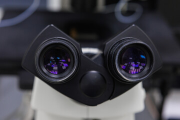 A closeup view of a microscope eyepiece, which is essential for detailed laboratory research and observation