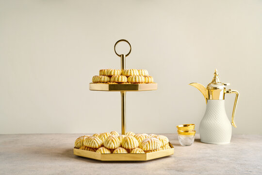 Assorted semolina maamoul or mamoul cookies with dallah. Traditional arabic Eid al Adha, Eid al Fitr sweets	