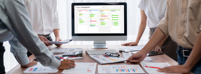 Project planning software for brisk business project management on the computer screen showing...
