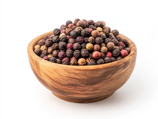 Szechuan pepper in a wooden bowl on a white surface