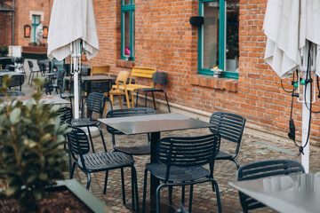 Outdoor cafe seating with tables and chairs