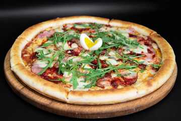 Hot pizza on a black background