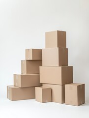 Obraz premium A stack of plain moving boxes in various sizes