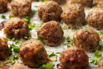 Homemade beef and pork meatballs on baking paper