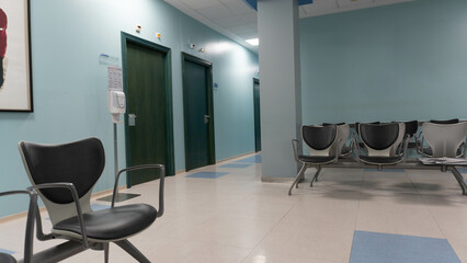 Waiting room with no one in a health center with corridors deserted of people