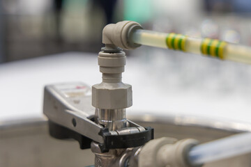 A keg of beer. The keg has a rotating tap for tapping beer