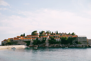 Naklejka premium Boats are moored off the island of Sveti Stefan. Montenegro