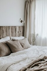 Warm and inviting bedroom featuring organic linen duvet and reclaimed wood headboard
