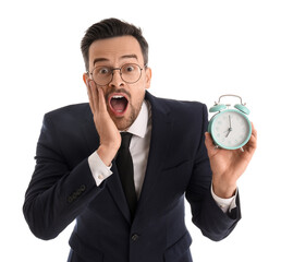 Funny shocked businessman with alarm clock isolated on white background
