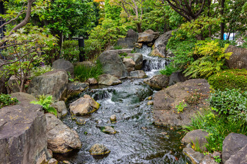 Waterfall in garden of Senso-ji temple in Asakusa, Tokyo, Japan