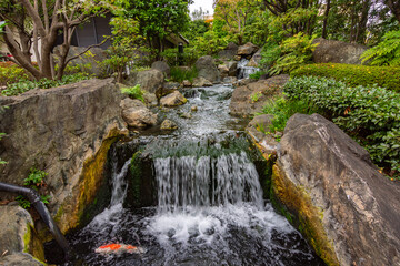 Waterfall in garden of Senso-ji temple in Asakusa, Tokyo, Japan