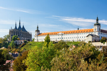 View of St. Barbara's Cathedral under a clear, sunny sky with a few scattered clouds. The majestic...