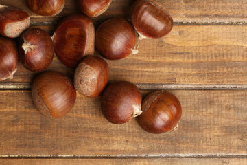 fresh chestnuts on a wooden table
