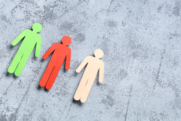 Paper human figures on grunge background