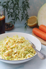 A bowl with coleslow salad