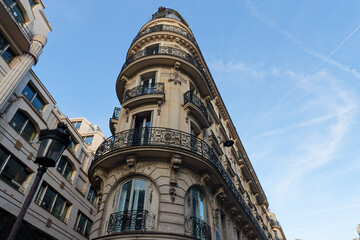 Fototapeta premium Exterior architecture of Traditional French house with typical balconies and windows in Paris. France.