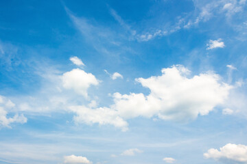 sky with fluffy clouds. holiday windy forecast. white cumulus cloudscape on a blue gradient of atmosphere. sunny summer weather. scenic nature background. meteorology backdrop. fresh air