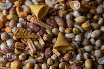 Variety of colorful snacks displayed in a vibrant and lively arrangement on a rustic surface