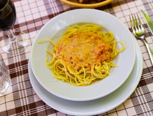Plate with pasta, made with in a salmon sauce