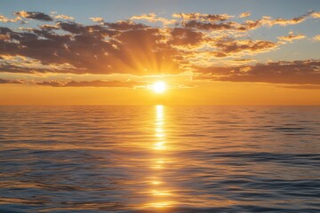 Fototapeta premium Sunset over tranquil ocean waters reflecting vibrant colors near the horizon