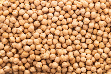 Heap of dried organic raw chickpeas - Cicer arietinum.