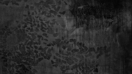 A black and white photo of a burnt out forest with charred trees and blackened leaves. Scene is somber and melancholic, as the destruction of the forest is a reminder of the fragility of nature