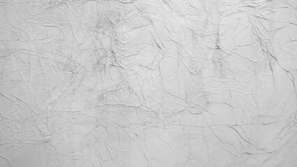 A white wall with a lot of lines and dots. The wall is very plain and has a lot of texture