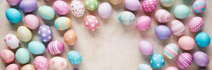 Fototapeta premium Easter greeting card. Pastel eggs decoration on color background, copy space, nobody
