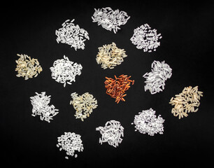 different kinds of organic asian thai rice variety grains on black background