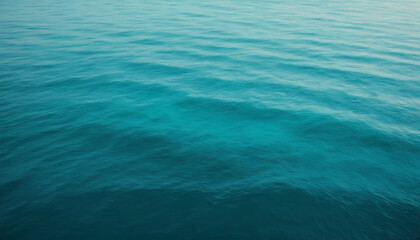 Obraz premium Oceanic teal-to-aqua gradient with soft light reflections and subtle grain effects