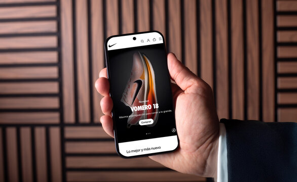 Innovative Nike Mobile App Displayed on Smartphone in User's Hand, Showcasing Cutting-Edge Features and Design for Sports Enthusiasts, Technology Concept