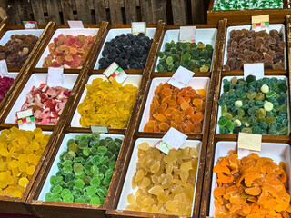 Colorful candied fruit on display at a market stall