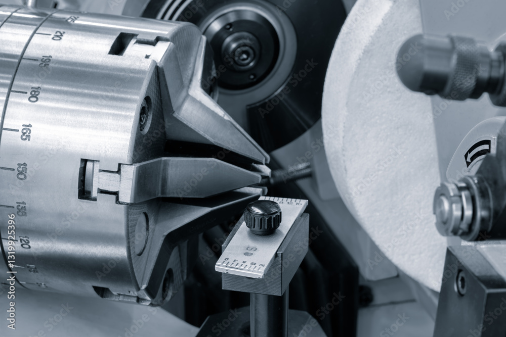 Aufkleber a piece of machinery with a white object in the middle. the machine is used for cutting and grinding